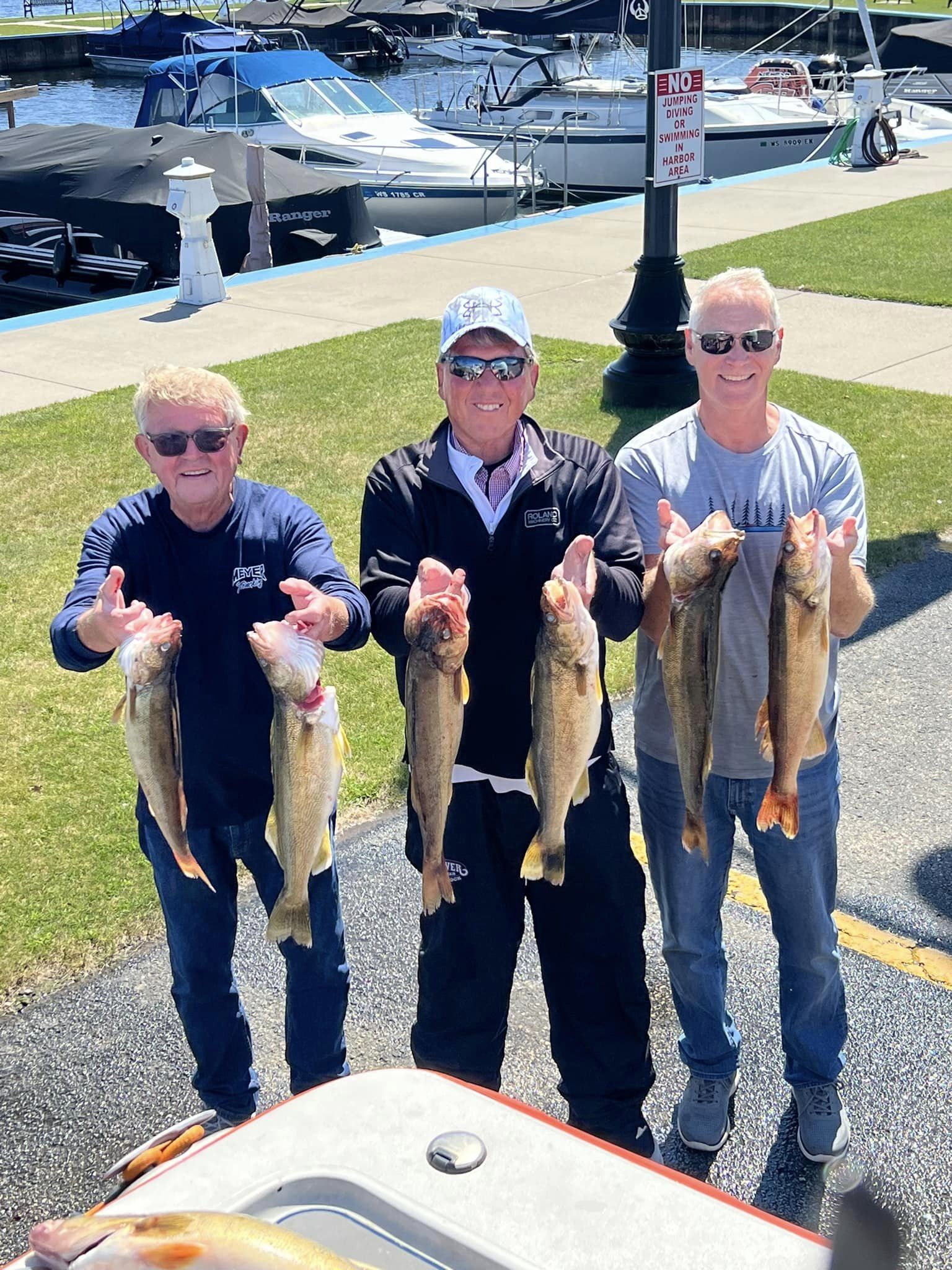 Charter guests displaying their walleye catch