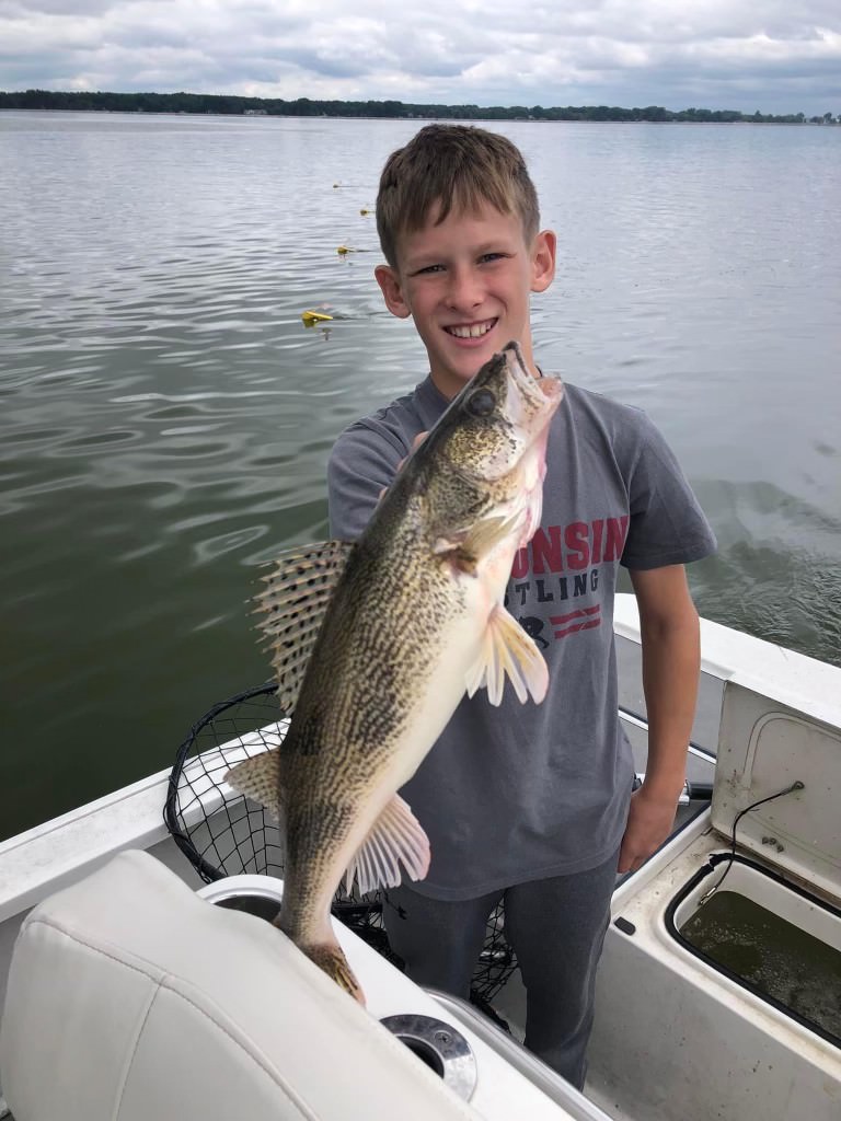 Guests and their catch from an Exclusively Walleye fishing trip