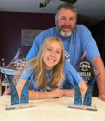 Captain Mike Lewis and his daughter Morgan with their fishing catches